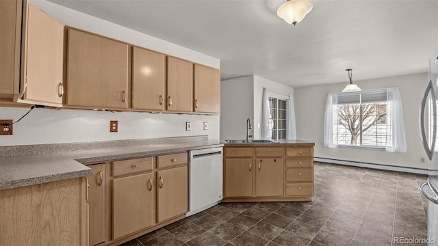 kitchen featuring dishwashing machine, a baseboard radiator, a peninsula, light brown cabinetry, and a sink