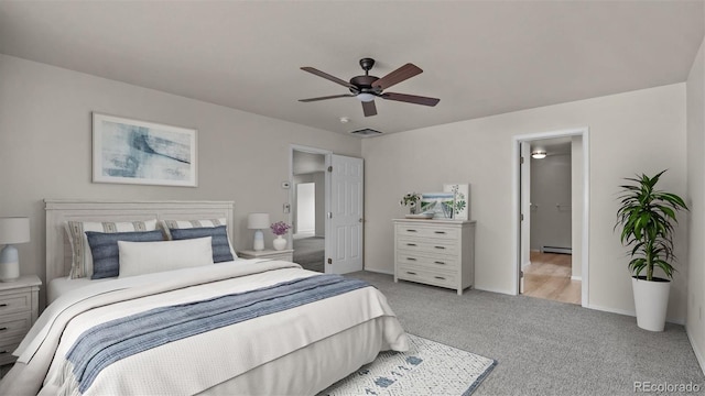 carpeted bedroom featuring baseboards, a baseboard radiator, visible vents, and a ceiling fan