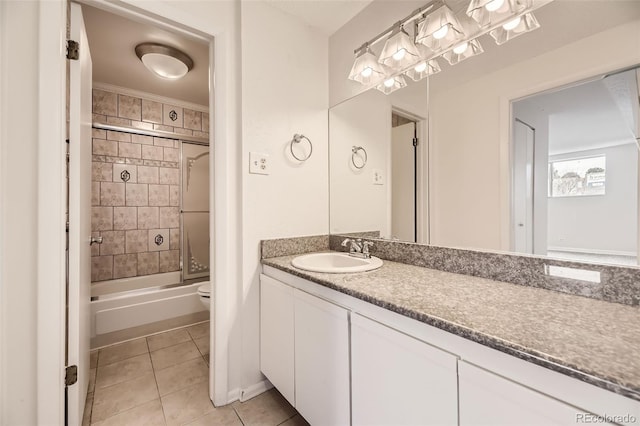 bathroom with tile patterned floors, crown molding, toilet, vanity, and shower / bath combination with glass door