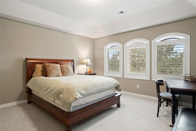 bedroom with light carpet