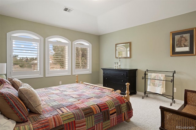 bedroom with light carpet