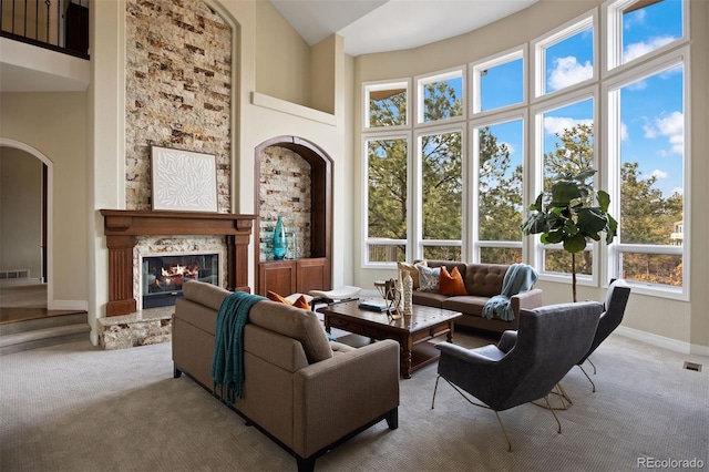 living room featuring a high ceiling and light carpet