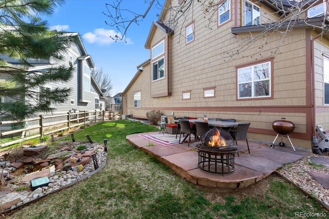 4236 Frederick Cir, Longmont, CO 80503 - rear view of house with an outdoor fire pit and a patio