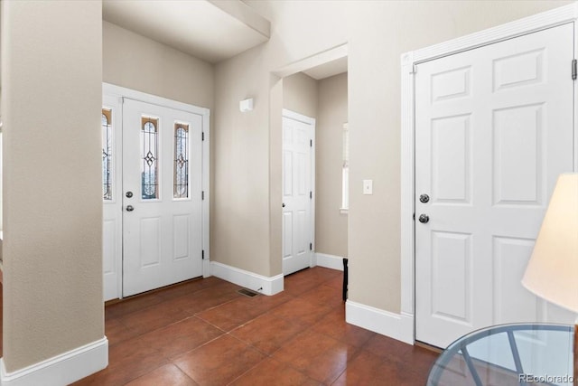 4236 Frederick Cir, Longmont, CO 80503 - entrance foyer with baseboards and dark tile patterned flooring