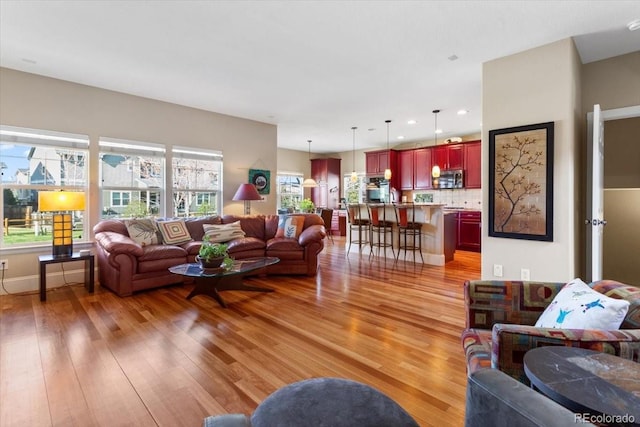 4236 Frederick Cir, Longmont, CO 80503 - living room with light wood finished floors and recessed lighting