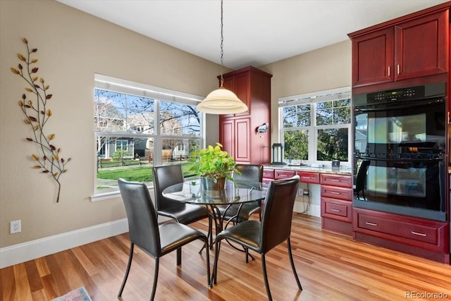 4236 Frederick Cir, Longmont, CO 80503 - dining area featuring light wood finished floors and baseboards