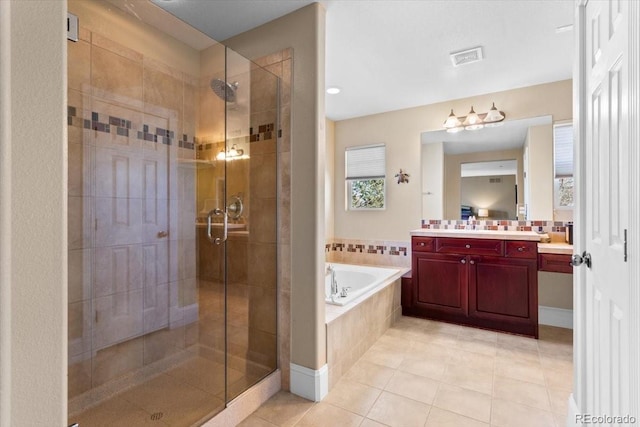 4236 Frederick Cir, Longmont, CO 80503 - full bathroom featuring a shower stall, a bath, vanity, and tile patterned floors