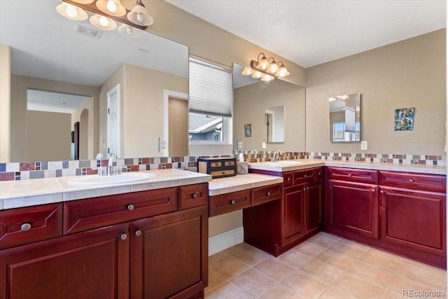 4236 Frederick Cir, Longmont, CO 80503 - bathroom with backsplash, tile patterned flooring, and vanity