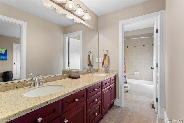 4236 Frederick Cir, Longmont, CO 80503 - full bath featuring tile patterned floors, double vanity, toilet, and shower / bath combo with shower curtain