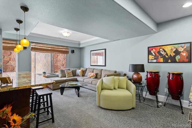 4236 Frederick Cir, Longmont, CO 80503 - carpeted living room featuring a tray ceiling, baseboards, and a textured ceiling