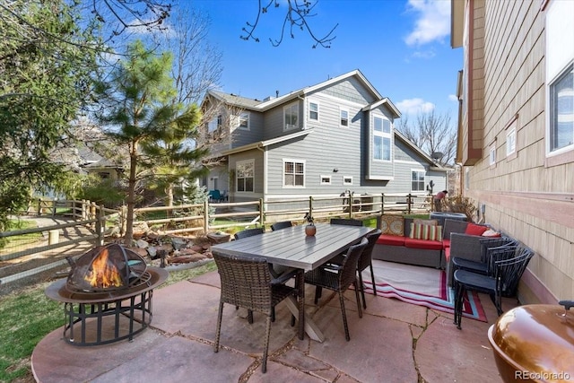 4236 Frederick Cir, Longmont, CO 80503 - view of patio featuring a fire pit, a fenced backyard, and outdoor dining space