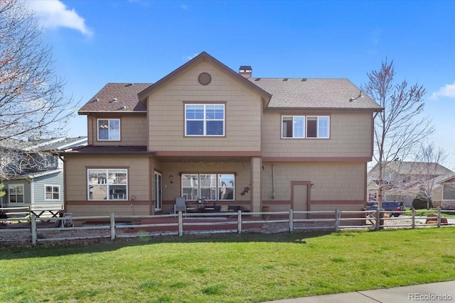 4236 Frederick Cir, Longmont, CO 80503 - rear view of property featuring a shingled roof, a patio, and a chimney