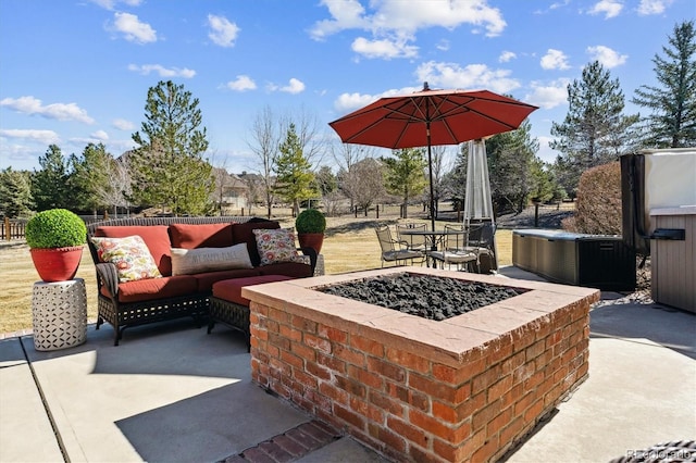 view of patio with an outdoor living space with a fire pit and fence