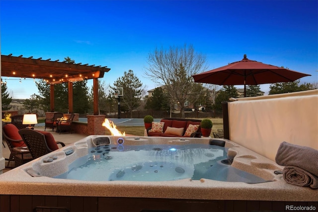 exterior space featuring a pergola and a hot tub