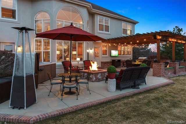 view of patio / terrace featuring an outdoor fire pit and a pergola