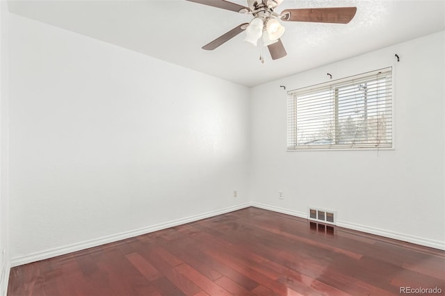 empty room featuring ceiling fan and wood-type flooring