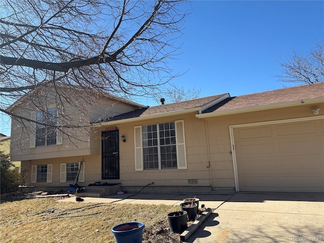 split level home featuring a garage