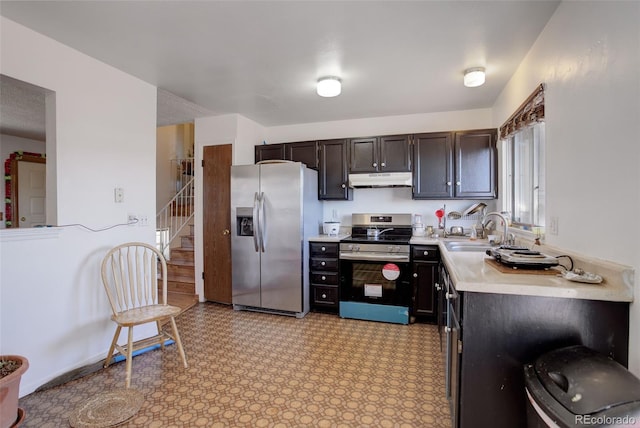 kitchen featuring dark brown cabinetry, sink, and stainless steel appliances