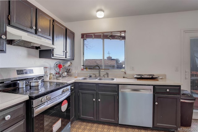 kitchen featuring dark brown cabinetry, appliances with stainless steel finishes, and sink