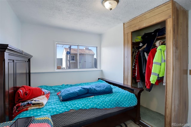 bedroom featuring a closet and a textured ceiling