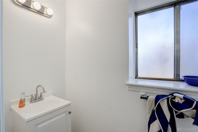 bathroom with vanity and plenty of natural light