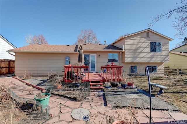 back of house with a wooden deck