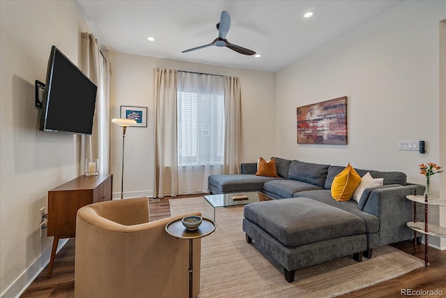 living area with baseboards, wood finished floors, a ceiling fan, and recessed lighting