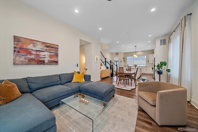 5189 Vivian St, Wheat Ridge, CO 80033 - living area featuring wood finished floors, stairs, and recessed lighting
