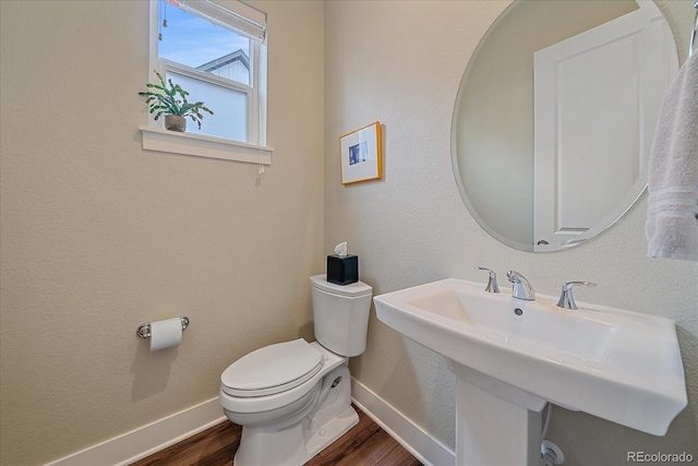 5189 Vivian St, Wheat Ridge, CO 80033 - bathroom featuring wood finished floors and a sink