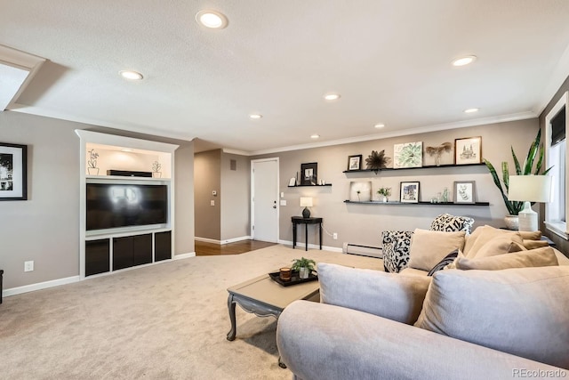 carpeted living area featuring a baseboard heating unit, recessed lighting, and ornamental molding