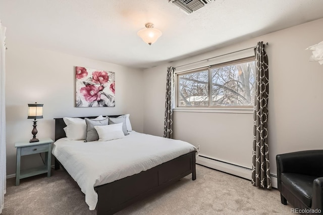 bedroom with light carpet, baseboard heating, and visible vents