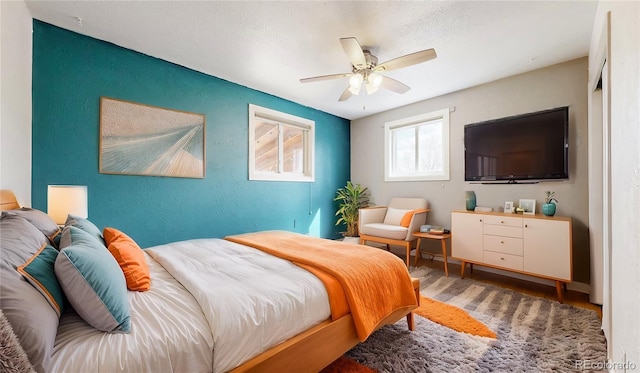 bedroom featuring ceiling fan and wood finished floors