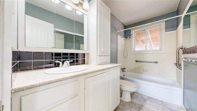 bathroom with shower / tub combination, tile patterned floors, toilet, and vanity