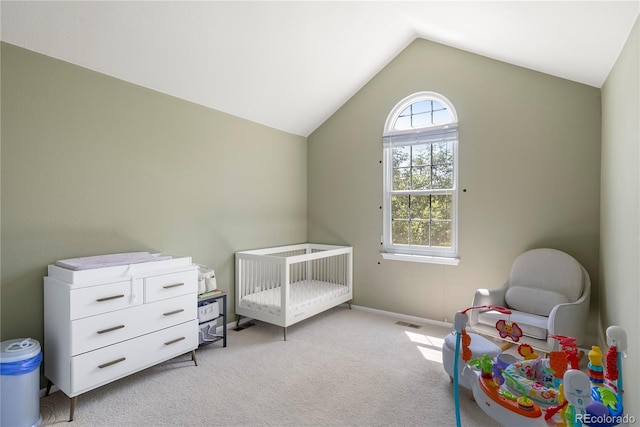 carpeted bedroom featuring visible vents, baseboards, and vaulted ceiling