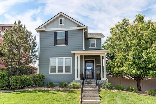 21418 E Stroll Ave, Parker, CO 80138 - view of front of home with a front yard and board and batten siding