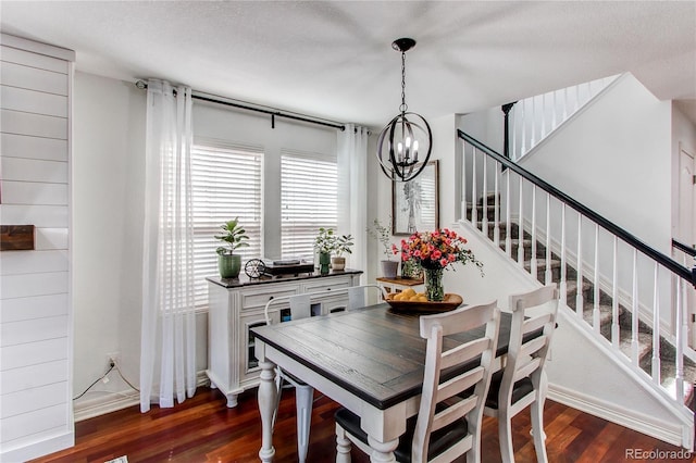 21418 E Stroll Ave, Parker, CO 80138 - dining space featuring a chandelier, dark wood finished floors, stairway, and baseboards