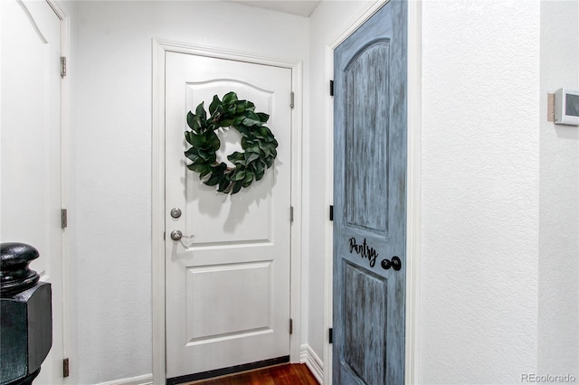 21418 E Stroll Ave, Parker, CO 80138 - entrance foyer with dark wood finished floors and baseboards
