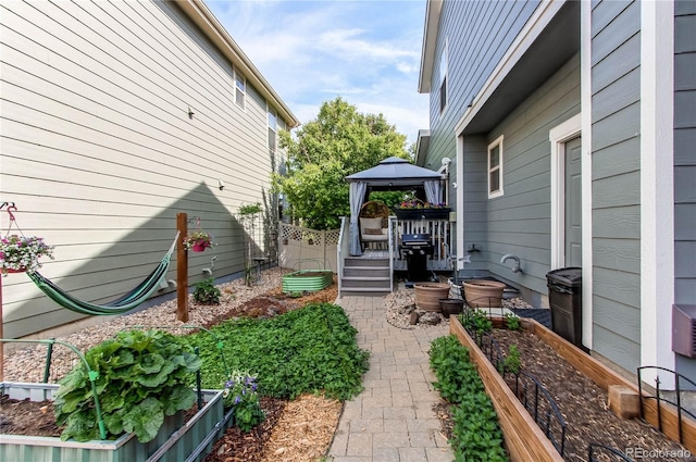 21418 E Stroll Ave, Parker, CO 80138 - view of yard featuring a gazebo, a garden, and a patio