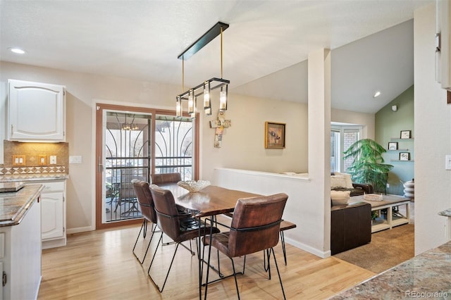 dining area featuring vaulted ceiling, recessed lighting, baseboards, and light wood finished floors