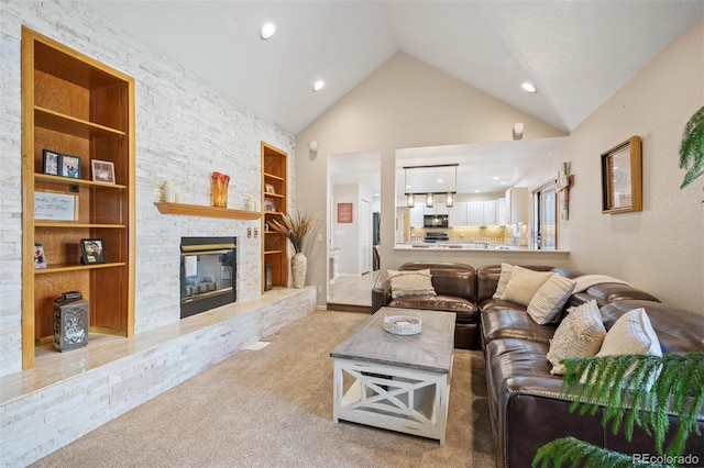 living area with built in shelves, light carpet, a stone fireplace, recessed lighting, and high vaulted ceiling