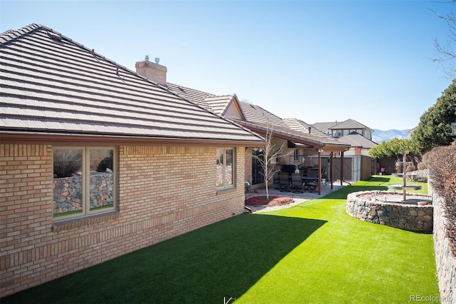 view of yard with a patio and fence