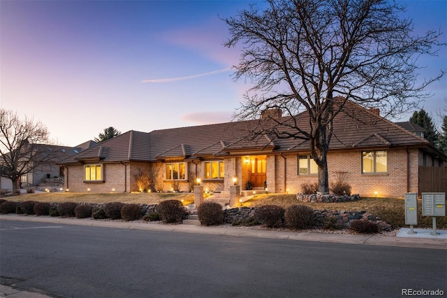 view of front of house with brick siding