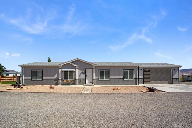 62069 Jade Rd, Montrose, CO 81401 - manufactured / mobile home with concrete driveway, a garage, and a shingled roof