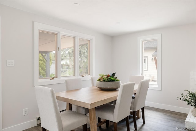 3540 Everett St, Wheat Ridge, CO 80033 - dining room featuring baseboards and dark wood finished floors