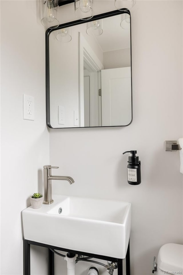 3540 Everett St, Wheat Ridge, CO 80033 - bathroom featuring a sink and toilet