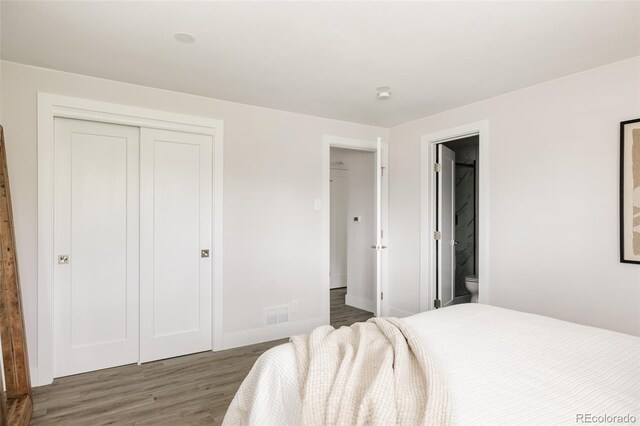 3540 Everett St, Wheat Ridge, CO 80033 - bedroom featuring wood finished floors, a closet, and ensuite bath