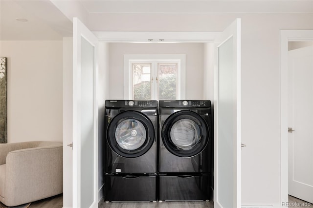 3540 Everett St, Wheat Ridge, CO 80033 - washroom with washer and dryer and baseboards