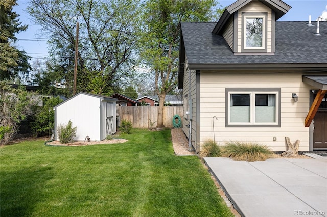 3540 Everett St, Wheat Ridge, CO 80033 - view of side of property with a storage shed, roof with shingles, and an outdoor structure