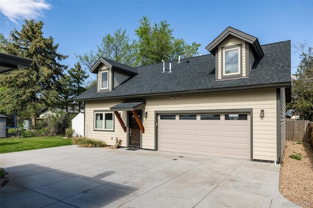 3540 Everett St, Wheat Ridge, CO 80033 - cape cod home with fence, concrete driveway, and roof with shingles