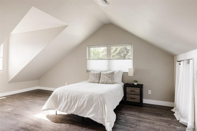 3540 Everett St, Wheat Ridge, CO 80033 - bedroom featuring vaulted ceiling, dark wood-type flooring, and baseboards